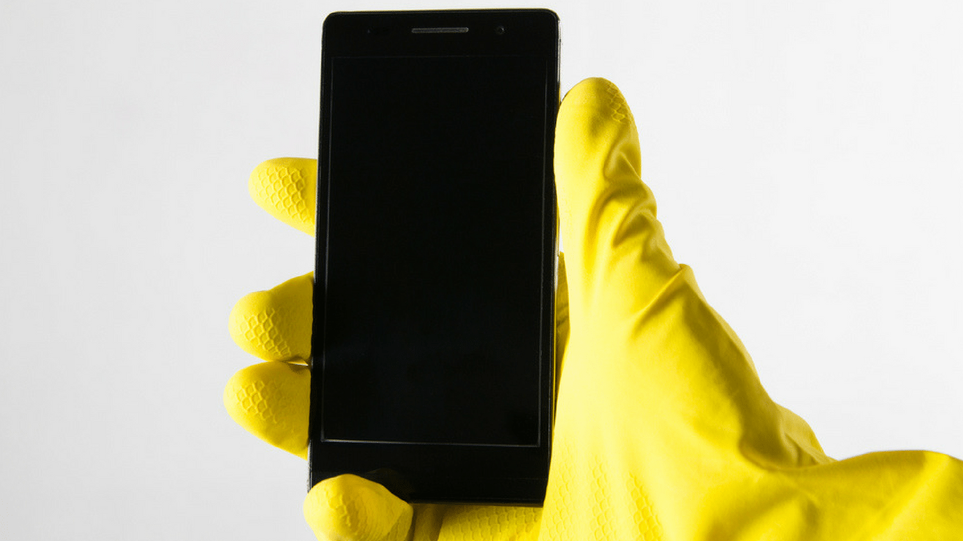 holding a phone with gloves